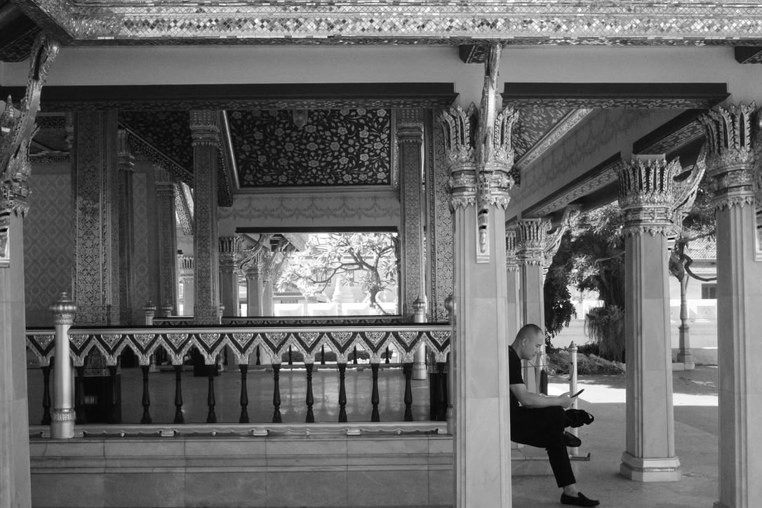 Man reading inside of a temple